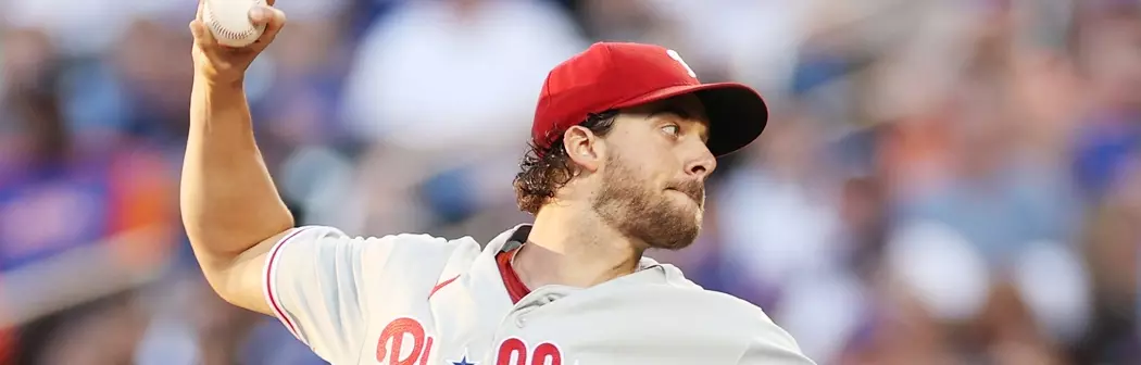 On frame, Aaron Nola about to shoot a ball. Thanks to his powerful arm, Phillies odds to win World Series surge ahead.